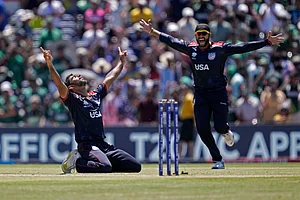 Photo: AP/PTI : United States' Saurabh Nethralvakar, left, celebrates after their win in the ICC Men's T20 World Cup cricket match against Pakistan at the Grand Prairie Stadium in Texas.