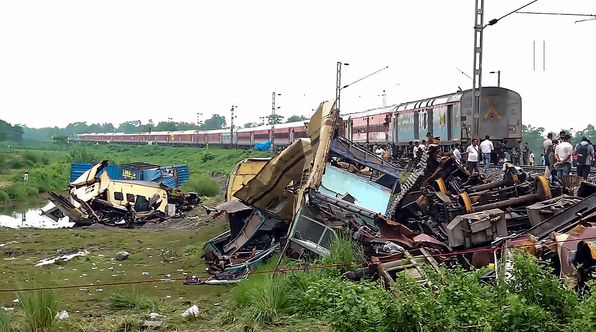 - PTI : New Jalpaiguri: A train runs through the accident area following restoration of services a day after the collision between the Kanchanjunga Express and a goods train, near Rangapani railway station, Tuesday, June 18, 2024. Atleast 10 people died and several others were injured in the accident, according to officials.