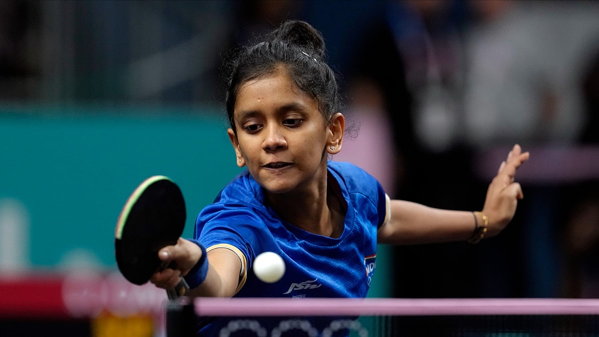 AP Photo/Petros Giannakouris : India's Sreeja Akula plays against Sinagapore's Zeng Jian during a women's singles round of 32 table tennis game at the 2024 Summer Olympics.