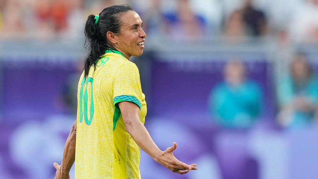 Brazil's Marta leaves the pitch after being shown a red card during a women's Group C football match between Brazil and Spain. - AP