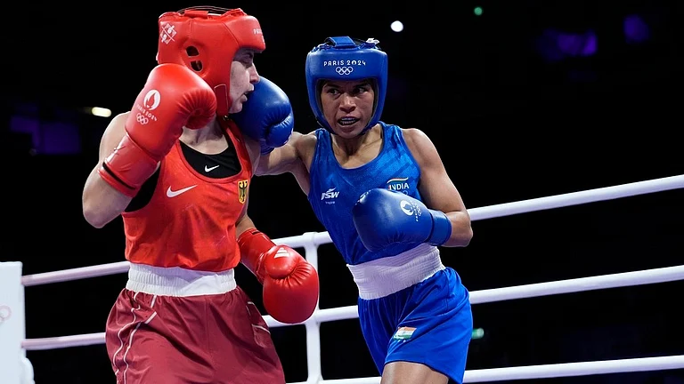 India's Nikhat Zareen (in Blue) in action at the Round of 32 boxing event at the Paris Olympics. - AP