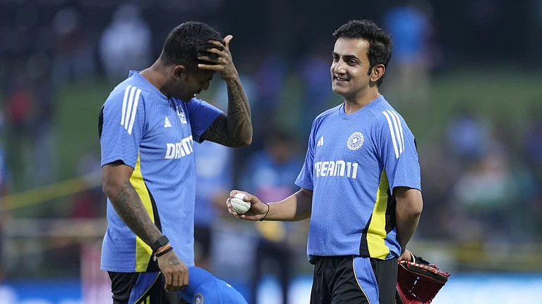 India's coach Gautam Gambhir, right, chats with captain Suryakumar Yadav before the first T20I against Sri Lanka in Pallekele. - AP