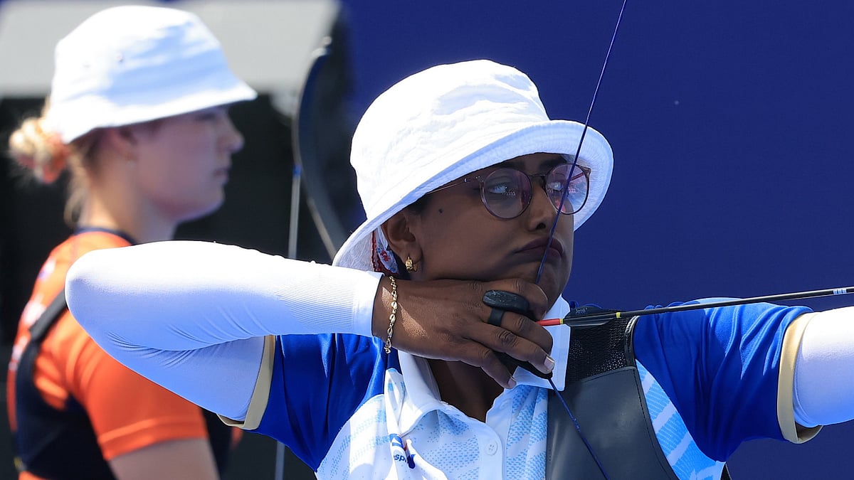 EPA-EFE/MARTIN DIVISEK VIA PTI : Deepika Kumari of India competes during the Women's Team Quarterfinal match against the Netherlands of the Archery competitions in the Paris 2024 Olympic Games, at the Invalides in Paris.