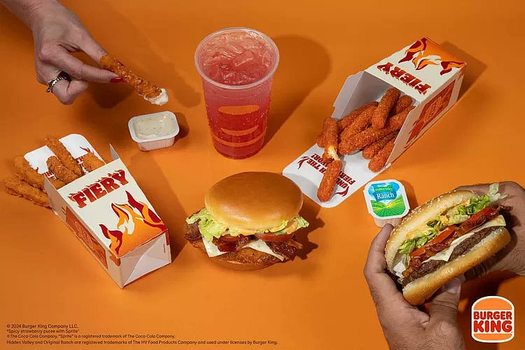 The menu includes varying spice levels, from the mild "Fiery Strawberry & Sprite" to the extra-hot "Fiery Bacon Royal Crispy Chicken Sandwich."