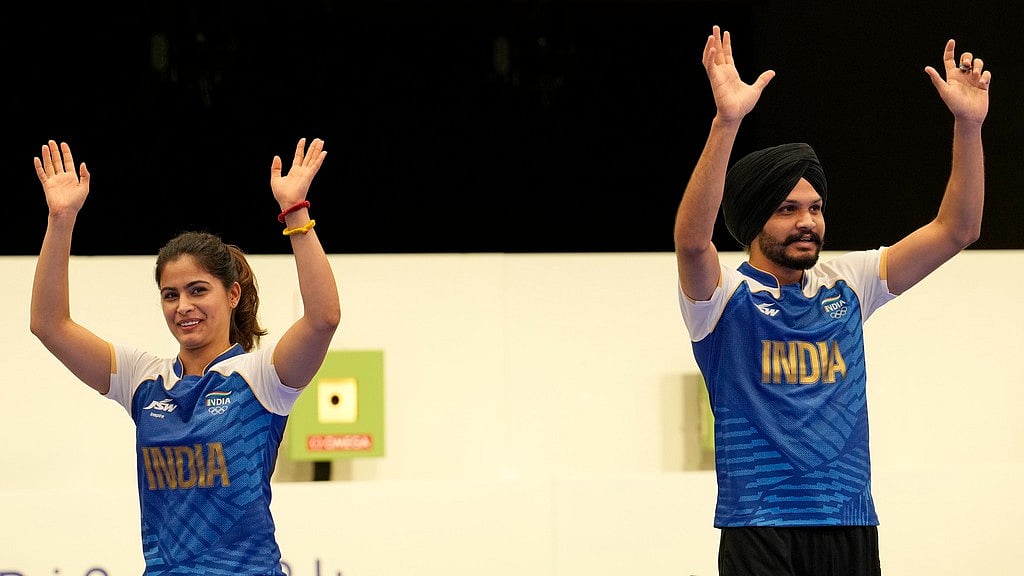 India's Manu Bhaker, left, and Sarabjot Singh celebrate after winning the bronze medal in the 10m air pistol mixed team event at the 2024 Summer Olympics, Tuesday, July 30, 2024, in Chateauroux, France. - AP/Manish Swarup