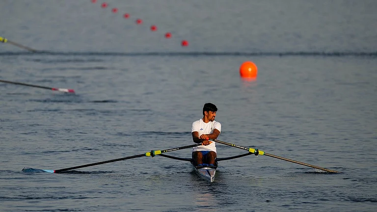 Balraj Panwar, of India, trains ahead of competing in the men's single sculls rowing quarterfinal at the 2024 Summer Olympics, Tuesday, July 30, 2024, in Vaires-sur-Marne, France. - AP/Lindsey Wasson