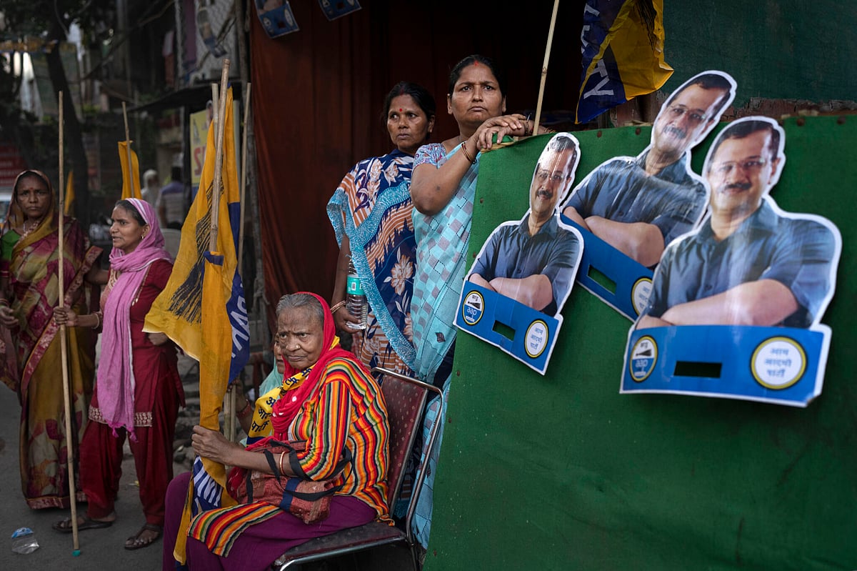 Supporters of Aam Admi Party wait for the arrival of Sunita Kejriwal, wife of the jailed Party leader and Delhi Chief Minister Arvind Kejriwal, who conducted a roadshow ahead of the third round of polling in the six-week long national election in New Delhi, India. - AP