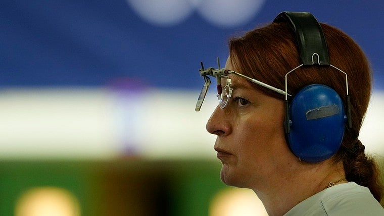 AP/Manish Swarup : Georgia's Nino Salukvadze competes during the 10m air pistol women's qualification round at the 2024 Summer Olympics, Saturday, July 27, 2024, in Chateauroux, France.