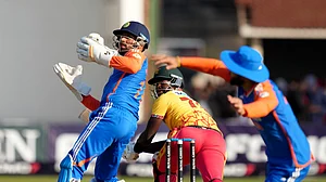 AP Photo/Tsvangirayi Mukwazhi : Zimbabwe batsman Luke Jongwe, centre, in action during the T20 cricket between Zimbabwe and India at Harare Sports Club, Harare.