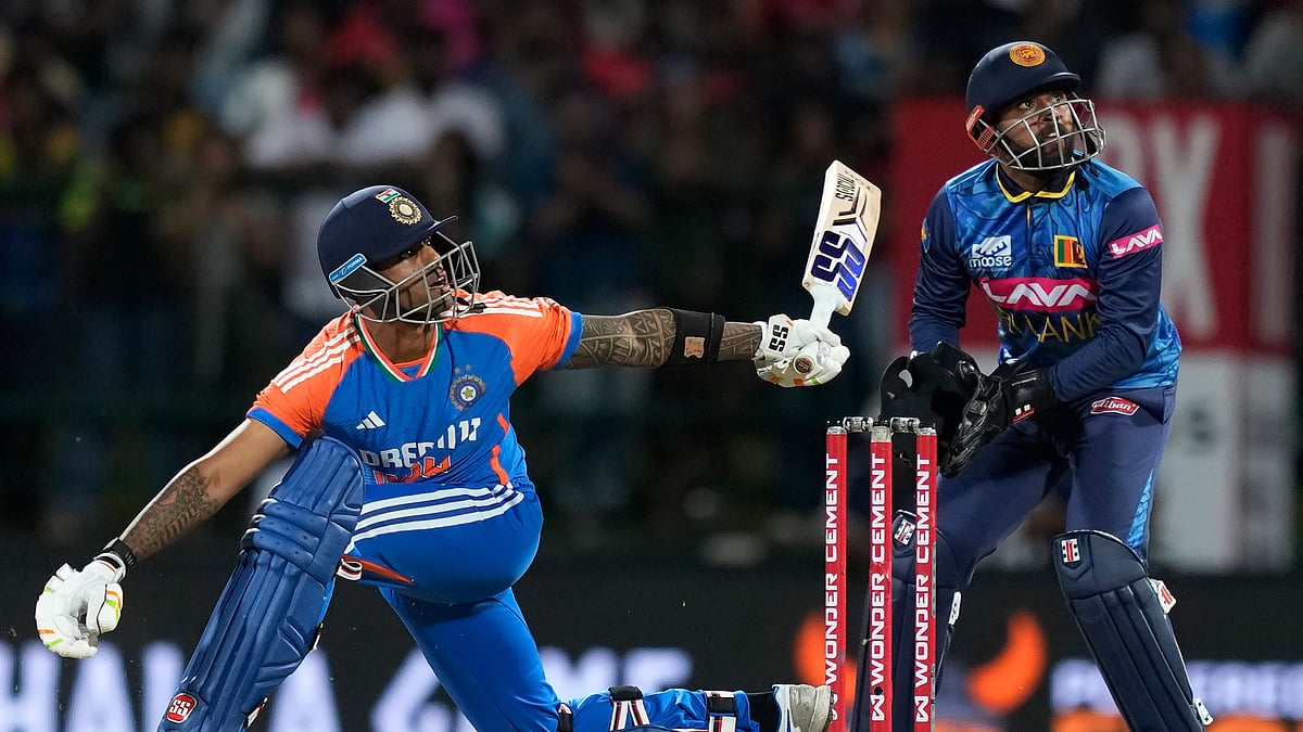 AP Photo/Eranga Jayawardena : India's captain Suryakumar Yadav watches his shot during the second Twenty20 cricket match between Sri Lanka and India in Pallekele, Sri Lanka.