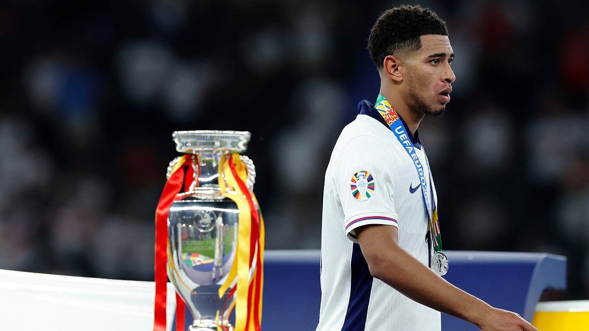 Jude Bellingham walks past the European Championship trophy after England's defeat