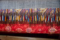 Getty Images : Wooden needles and pashmina yarn are being used to weave a traditional Kani Shawl on a loom in a shawl weaving factory on the outskirts of Srinagar. A traditional Kani Shawl in Kashmir, showcasing the exquisite craftsmanship and detailed artistry that have been revered since the Mughal Era.