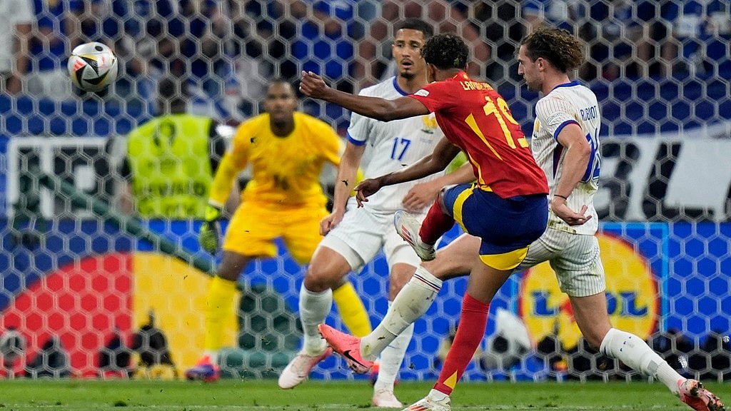 Spain's Lamine Yamal, center, scores his side's first goal during a semifinal match between Spain and France at the Euro 2024 soccer tournament in Munich, Germany, Tuesday, July 9, 2024. - AP/Matthias Schrader
