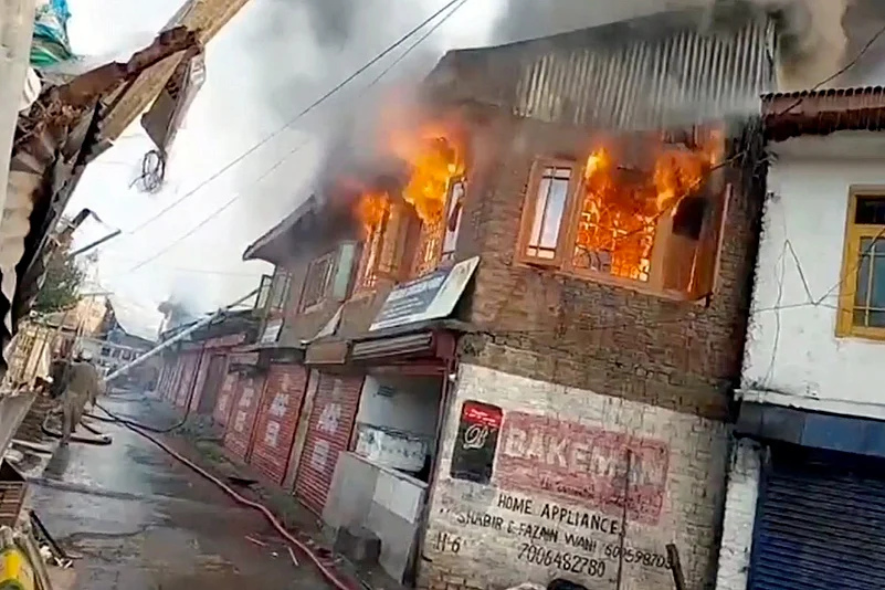 Smoke billows after Fire at shops in J&Ks Kupwara