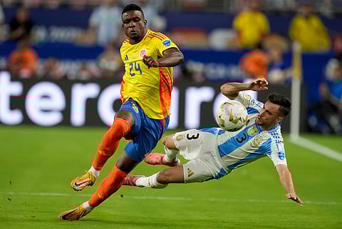 Colombia's Jhon Cordoba (24) and Argentina's Nicolas Tagliafico battle for the ball during the Copa America final.