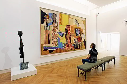 Spellbound: A visitor at the Picasso Museum in Paris viewing the painting ‘Women in the Bathroom’