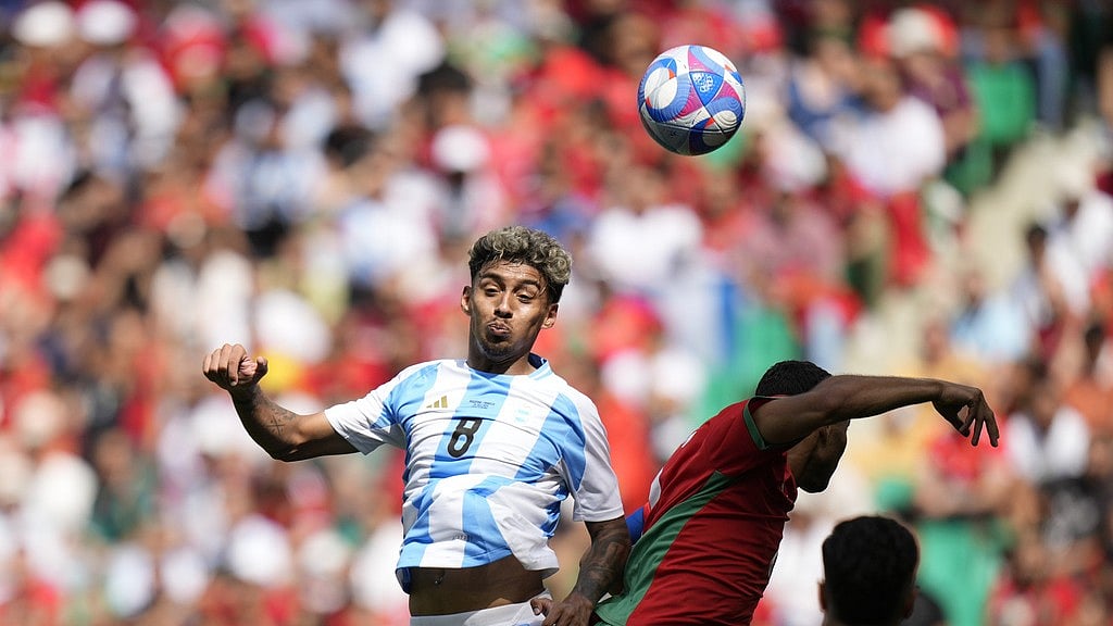 Cristian Medina (left) vies for the ball during the Argentina vs Morocco, Paris Olympic Games 2024 men's football match in Saint-Etienne, France on Wednesday (July 24). - AP