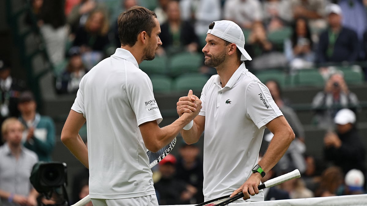 Grigor Dimitrov shakes hands with Daniil Medvedev. - null
