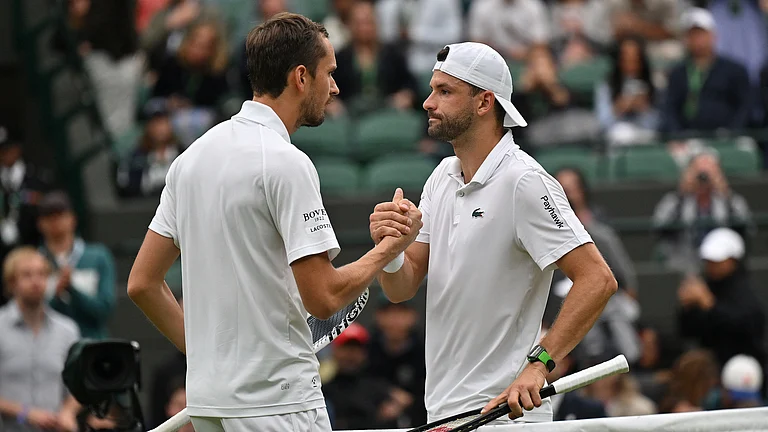 Grigor Dimitrov shakes hands with Daniil Medvedev. - null