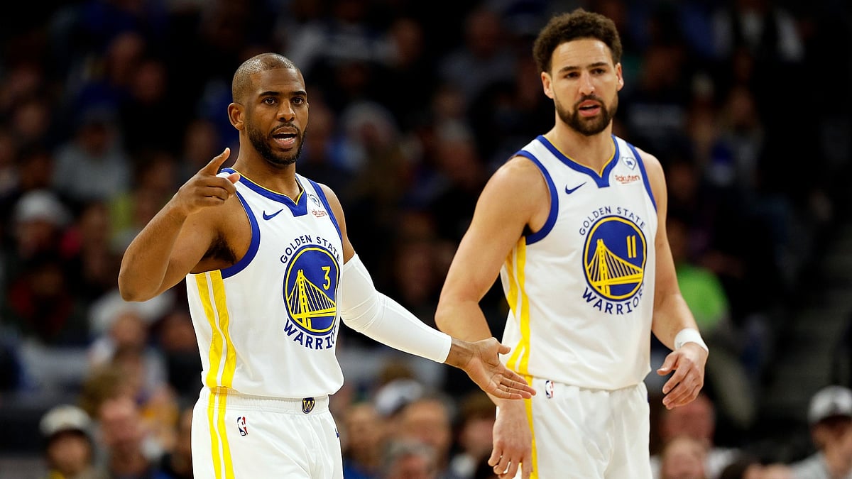 Chris Paul (left) and Klay Thompson of the Golden State Warriors look on during a game on March 24, 2024. - null