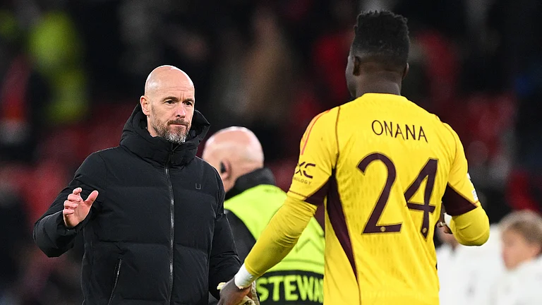 Manchester United manager Erik ten Hag with Andre Onana - null