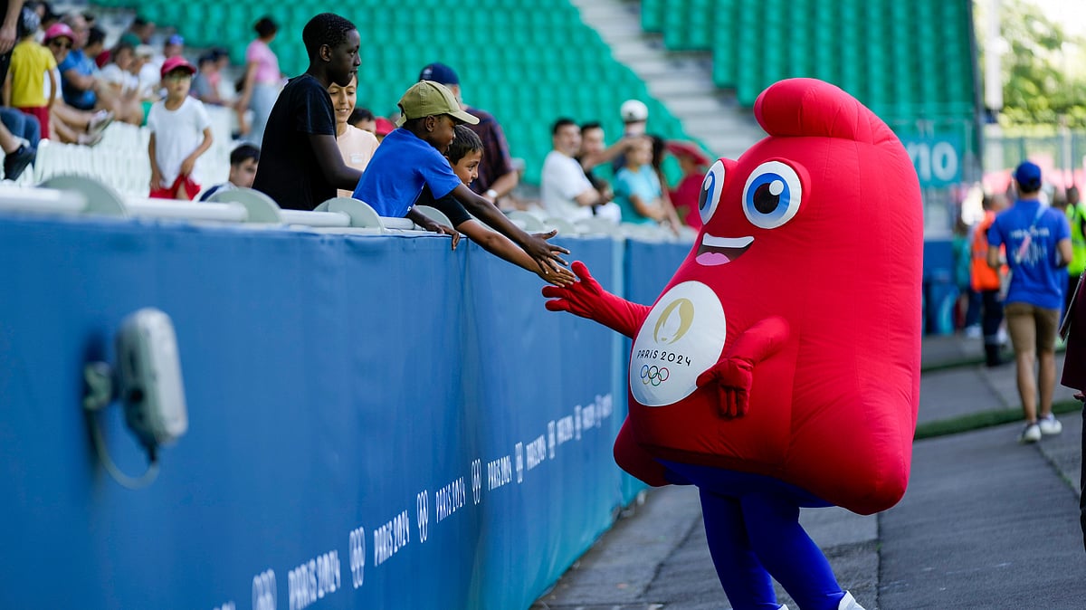 AP Photo/Silvia Izquierdo : The mascot for the Olympics greets fans before the women's Group A football match between Canada and New Zealand at Geoffroy-Guichard stadium during the 2024 Summer Olympics.