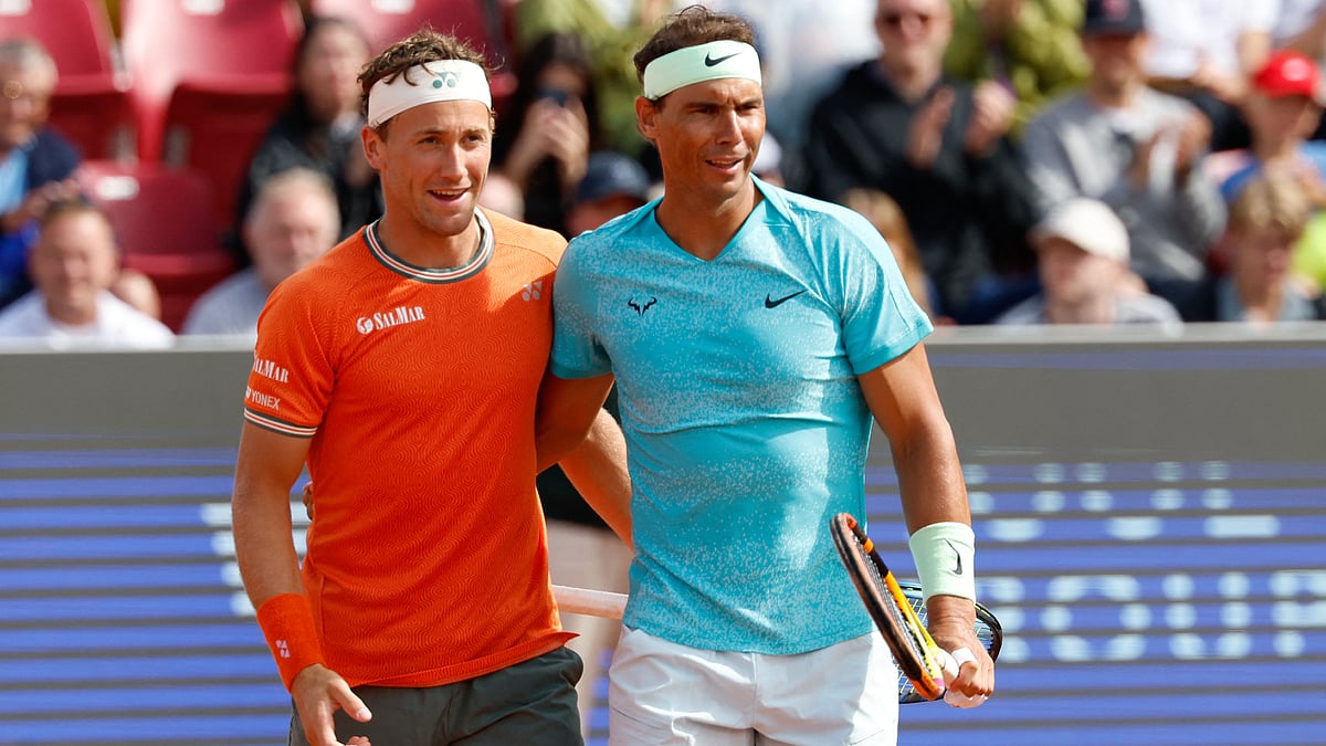 Casper Ruud and Rafael Nadal pose together after their win