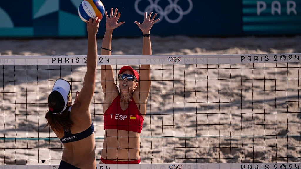 AP : Spain's Liliana Fernandez Steiner defends in the women's pool A beach volleyball match between Italy and Spain at Eiffel Tower Stadium at the 2024 Summer Olympics, Sunday, July 28, 2024, in Paris, France.