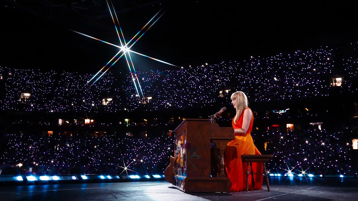 X : Taylor Swift performing during Eras Tour