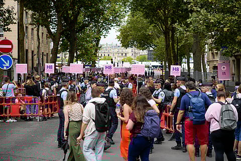 People start queuing to enter the opening ceremony of the 2024 Summer Olympics, Friday, July 26, 2024, in Paris, France.