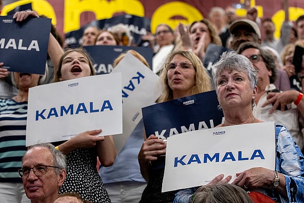 Getty Images : Supporters of Vice President Kamala Harris react to her speaking during a campaign rally at West Allis Central High School on July 23, 2024 in West Allis, Wisconsin. 