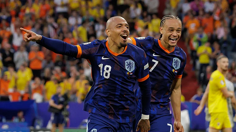 Donyell Malen and Xavi Simons celebrate for the Netherlands on Tuesday - null