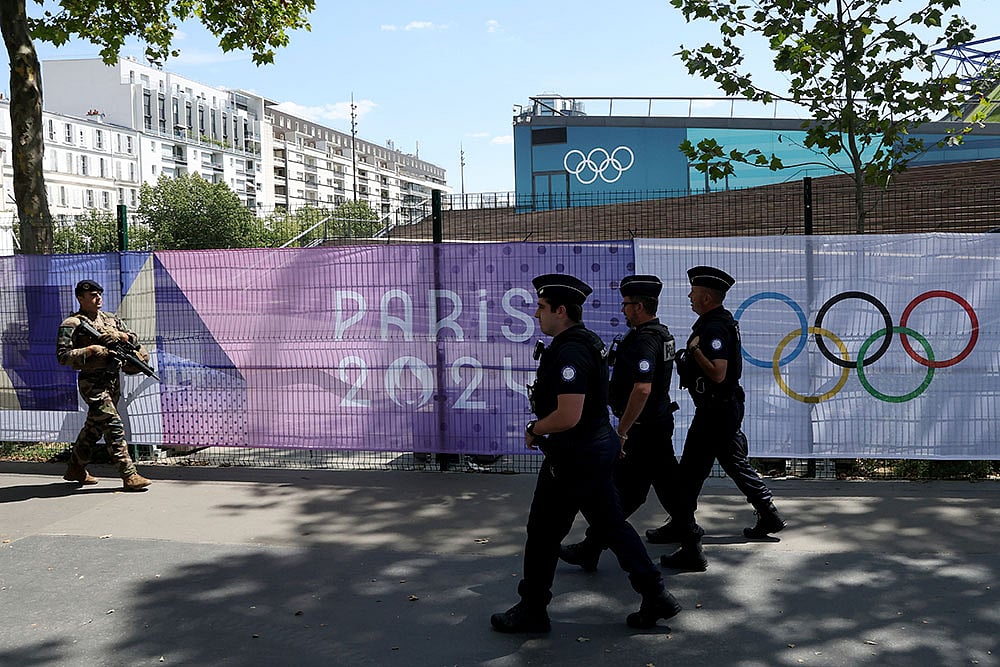 Photo: AP/Aurelien Morissard : Security At Paris Olympics