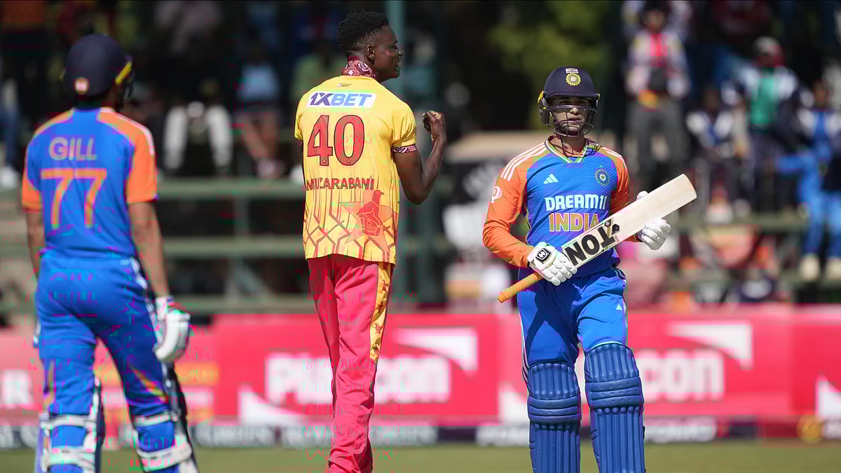 AP Photo/Tsvangirayi Mukwazhi : Zimbabwe bowler Blessing Muzarabani, centre, reacts after taking a wicket during the T20 cricket match between Zimbabwe and India at the Harare Sports Club, in Harare.