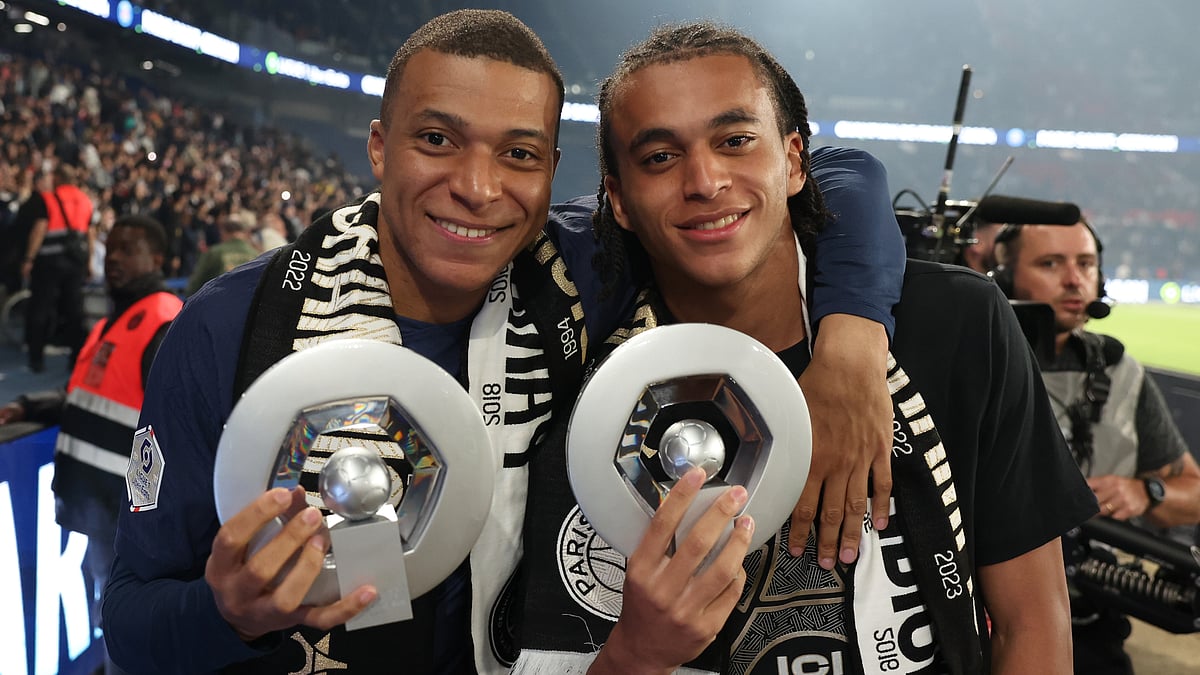 Ethan Mbappe poses with brother Kylian following Paris Saint-Germain's Ligue 1 title win - null