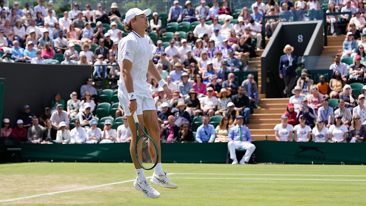 AP Photo/Alberto Pezzali : Alex de Minaur of Australia reacts during his second-round match against Jaume Munar of Spain at the Wimbledon tennis championships in London.