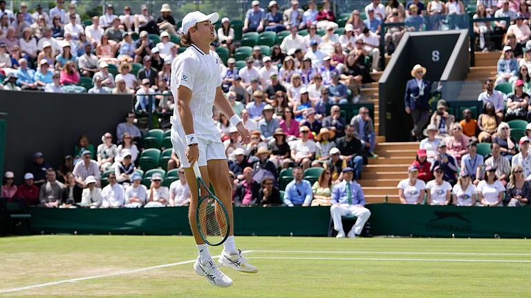 Alex de Minaur of Australia reacts during his second-round match against Jaume Munar of Spain at the Wimbledon tennis championships in London. - AP Photo/Alberto Pezzali