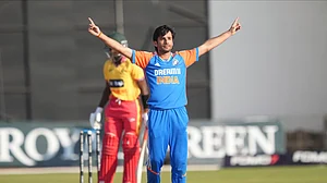 AP Photo/Tsvangirayi Mukwazhi : Indian bowler Ravi Bishnoi celebrates a wicket during the T20 cricket between Zimbabwe and India at Harare Sports Club, Harare.