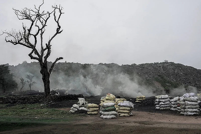 Scary Depths: In dozens of villages in Jharkhand, unrestricted coal mining has created deep pits; some are more than a thousand feet deep Photo: Vikram Sharma