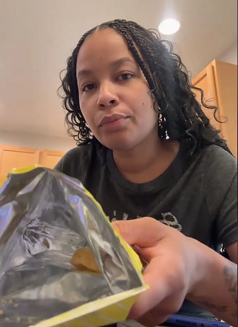 Tatiana showing the empty bag.
