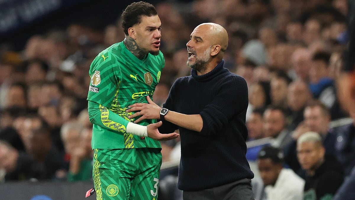 Pep Guardiola and Ederson.