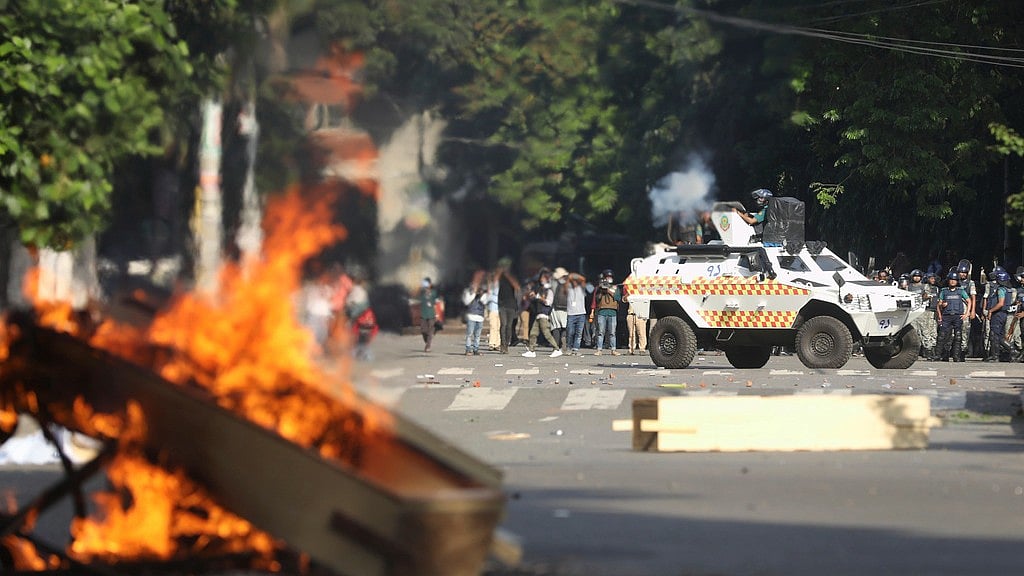 Police fire tear gas shells and rubber bullets to disperse students shouting slogans in favor of quota system in public service at the university campus, in Dhaka, Bangladesh, Wednesday, July 17, 2024 - AP/Rajib Dhar