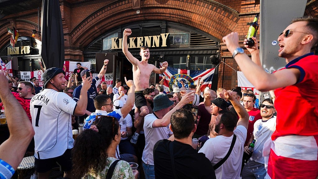 English soccer fans celebrate at the eve of the final match between England and Spain at the Euro 2024 soccer tournament in Berlin, Germany, Saturday, July 13, 2024.
 - AP/Markus Schreiber