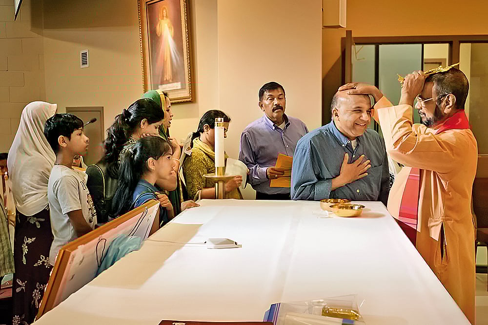 Waiting for Blessing: V P Joseph Valiyaveettil, founder of the Kreupasanam Marian Shrine, blesses devotees during a covenant counselling service