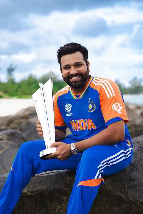 Rohit Sharma smiling with the T20 WC 2024 trophy.