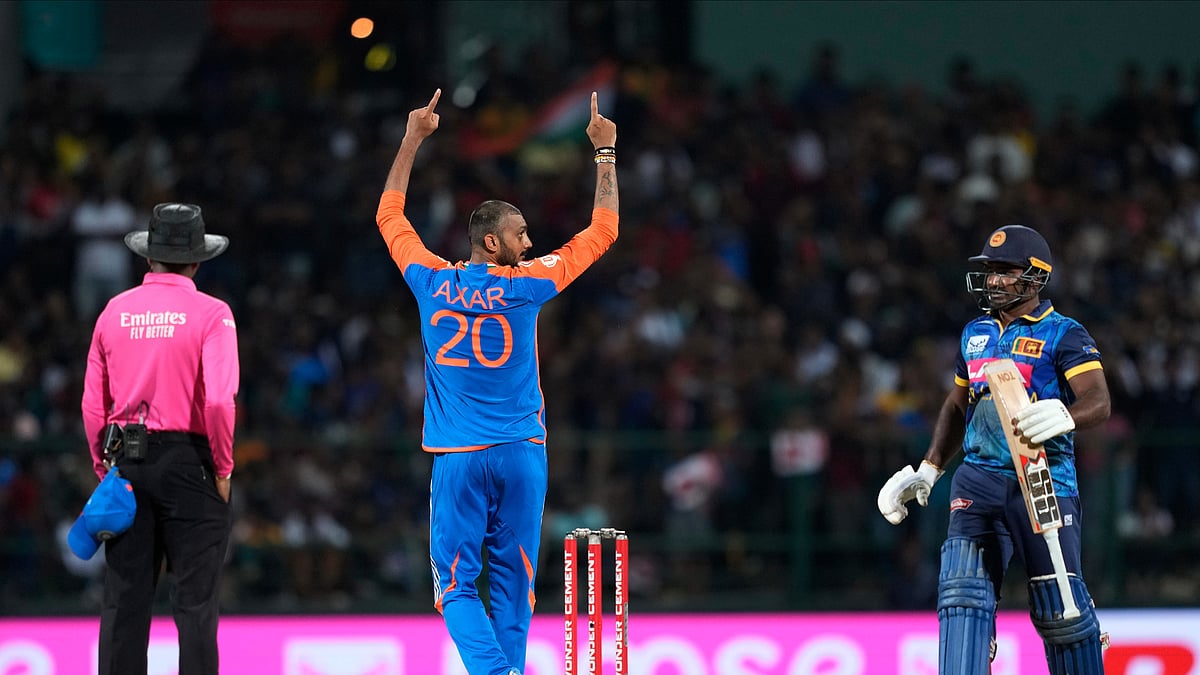 AP Photo/Eranga Jayawardena : India's Axar Patel celebrates the wicket of Sri Lanka's Kusal Perera during the first Twenty20 cricket match between Sri Lanka and India in Pallekele, Sri Lanka.