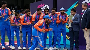 File : India's captain Rohit Sharma gestures playfully as he walks to collect the winners' after India won the ICC Men's T20 World Cup final cricket match against South Africa at Kensington Oval in Bridgetown, Barbados, Saturday, June 29, 2024.