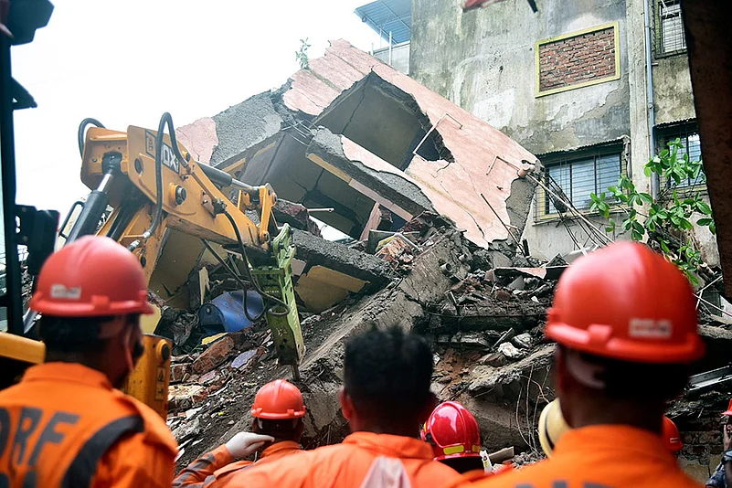 NDRF personnel conduct a rescue operation after Building collapsed in Navi Mumbais Belapur