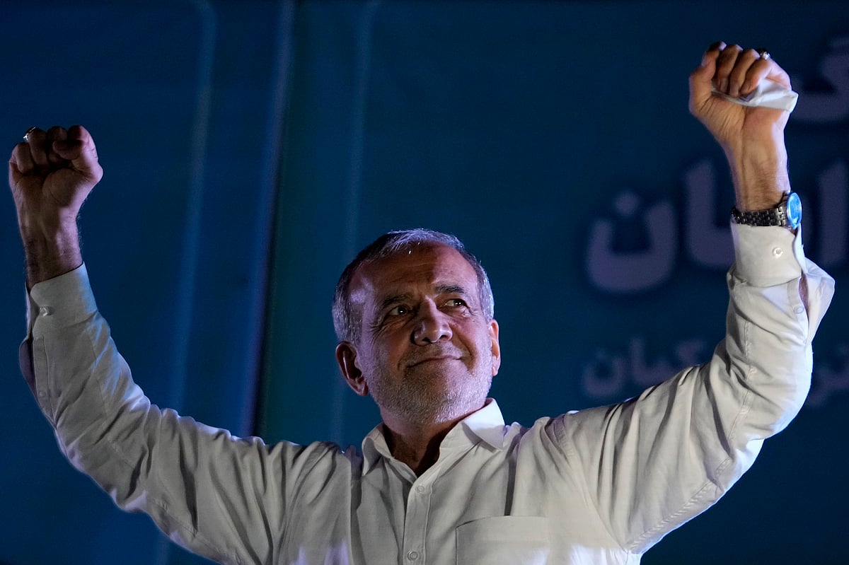 Reformist candidate for the Iran's presidential election Masoud Pezeshkian clenches his fists during a campaign rally in Tehran, Iran, Wednesday, July 3 - AP