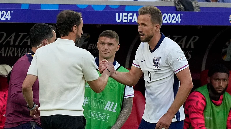 Englands manager Gareth Southgate, left, greets Englands Harry Kane during the quarterfinal match. AP Photo